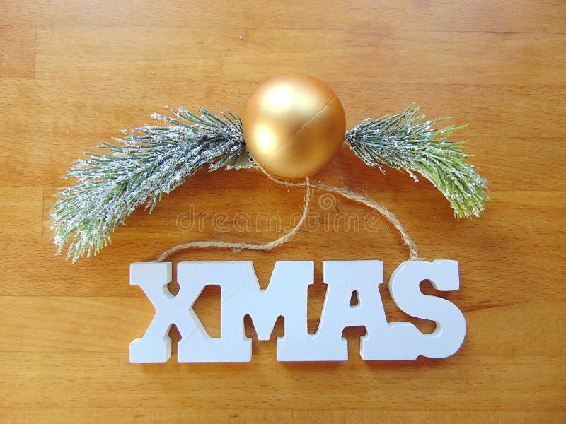 White Xmas Letters with Christmas Decoration on Wood Stock Photo