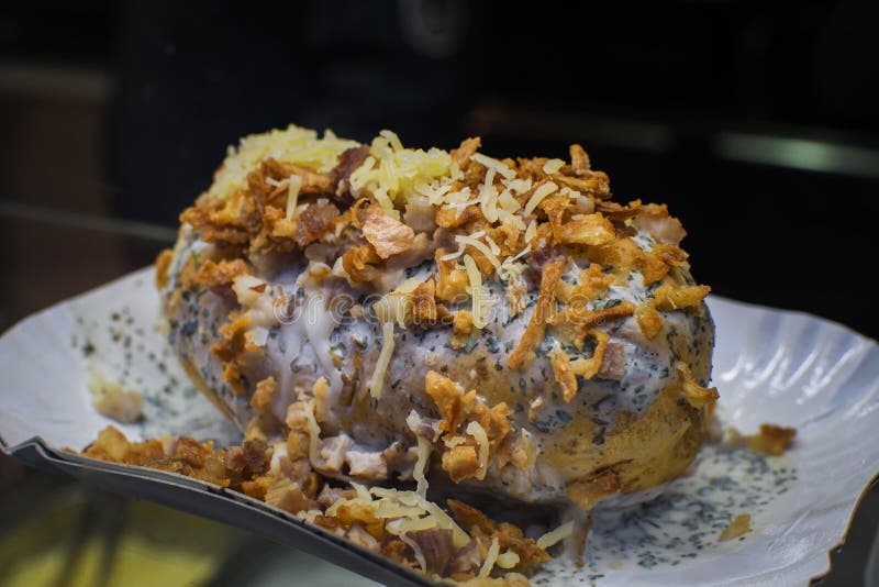 Whole Baked Potato with Cheese and Fried Onion Stock Image - Image of