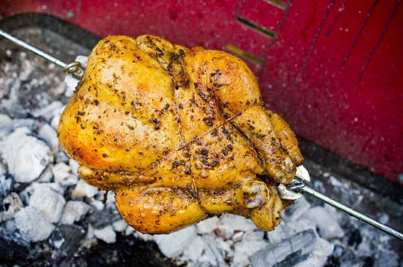Whole chicken on the grill stock photo. Image of homemade 33887594