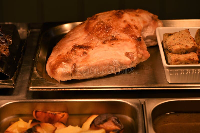 Whole cooked golden roast turkey breast with stuffing and gravy taken in a restaurant royalty free stock images Whole cooked golden roast turkey breast with stuffing and gravy taken in a restaurant royalty free stock images