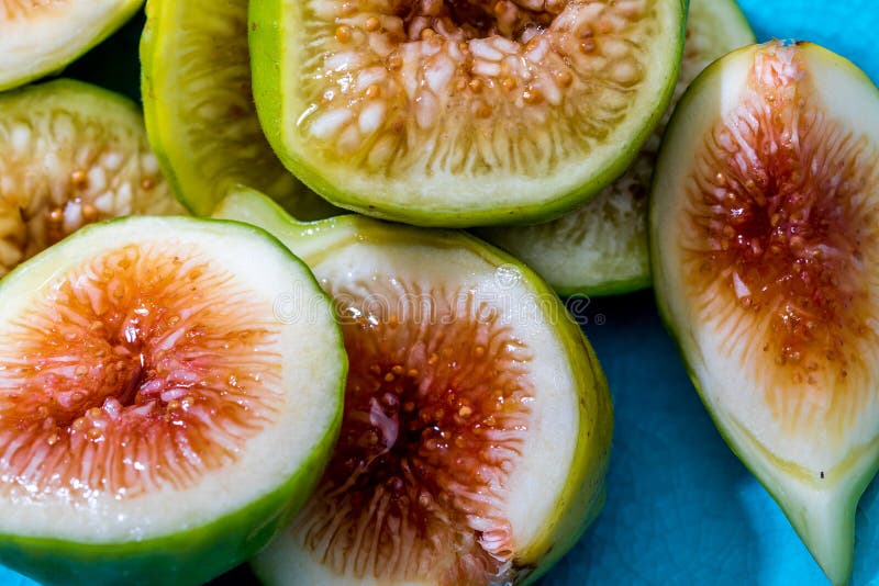 Whole and Cut Green Figs, with Honey. Foreground. on Colorful