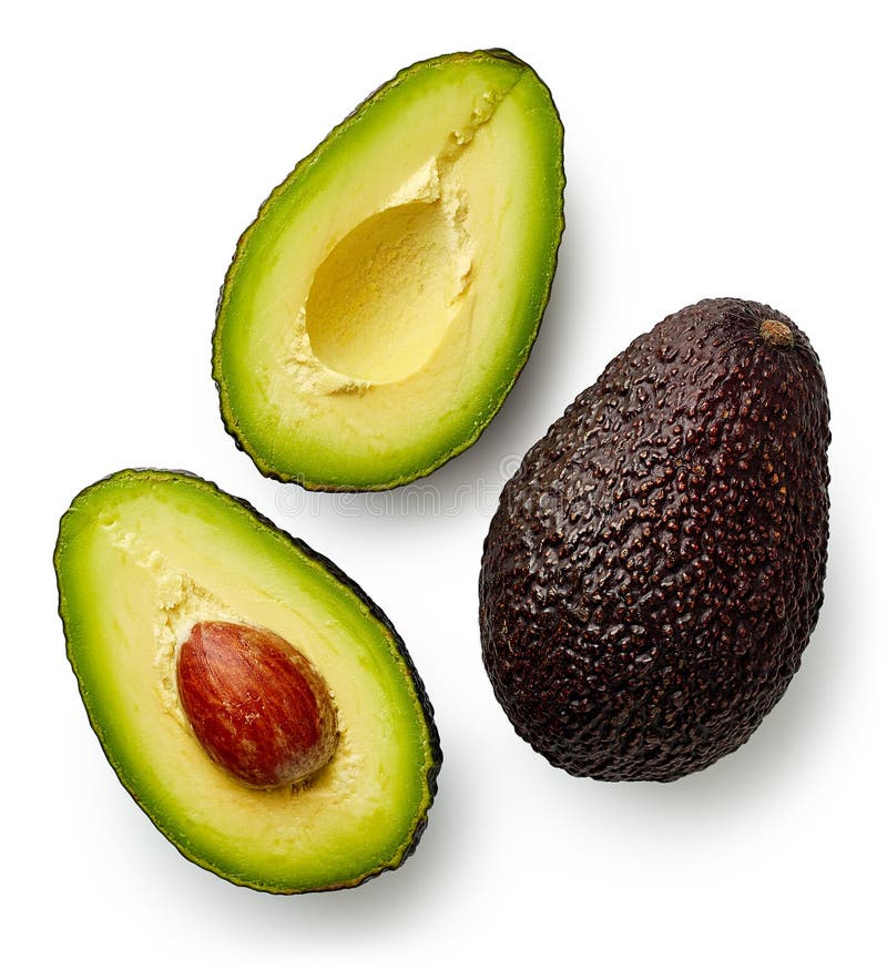 Whole and cut in half avocado royalty free stock image