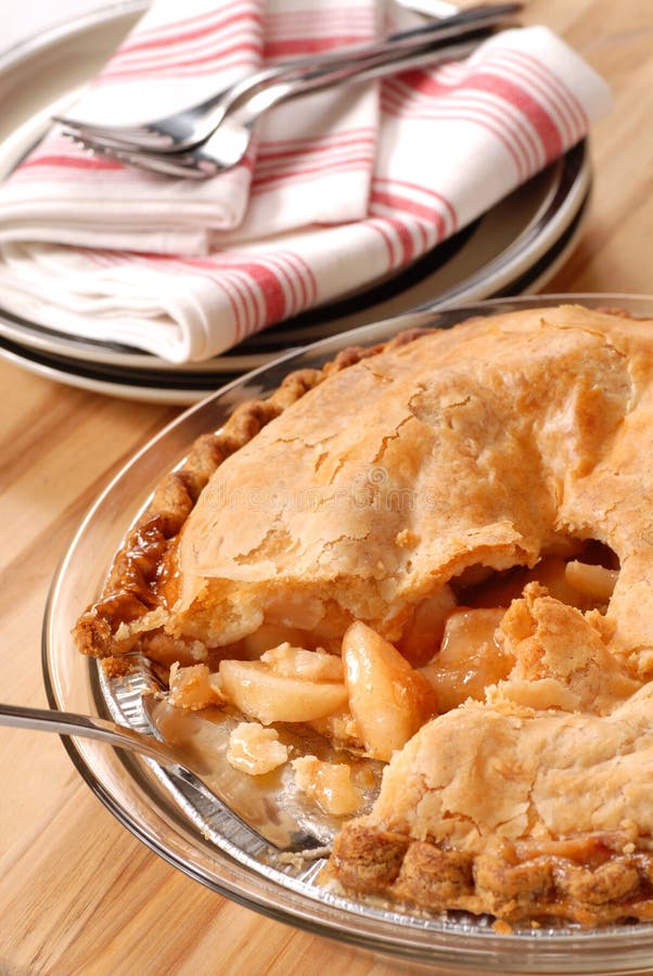 Whole deep dish apple pie with a flaky crust