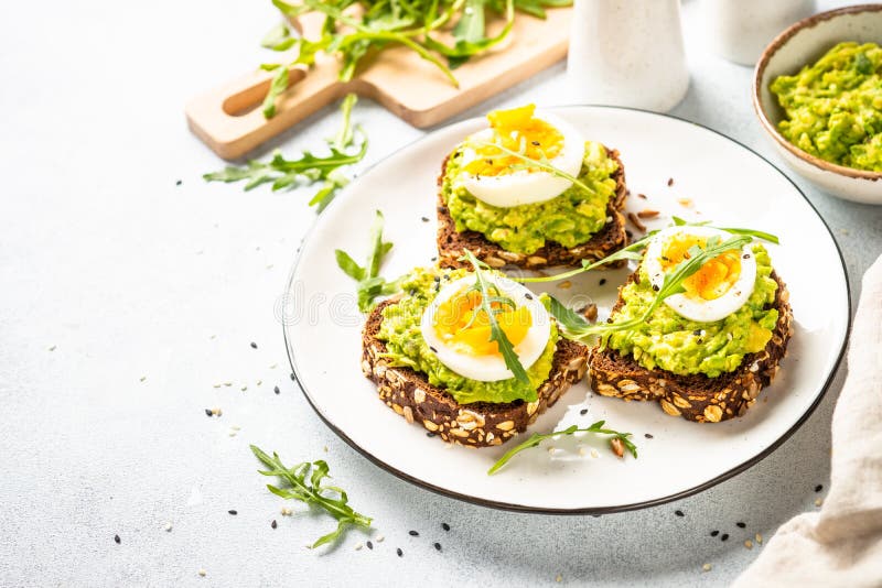 Whole Grain Bread with Avocado and Boiled Eggs. Stock Photo Image of