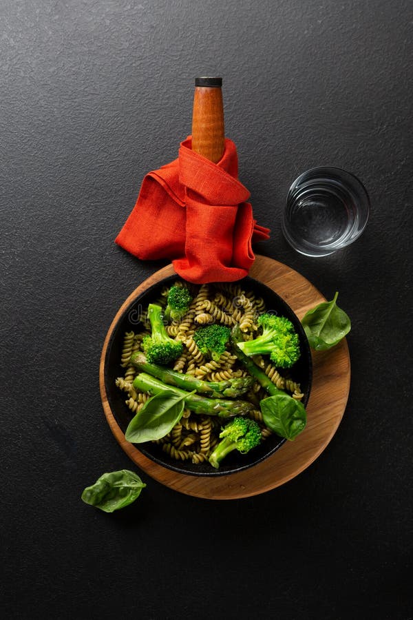 Whole Grain Pasta with Broccoli and Asparagus in Pan on Black Stone