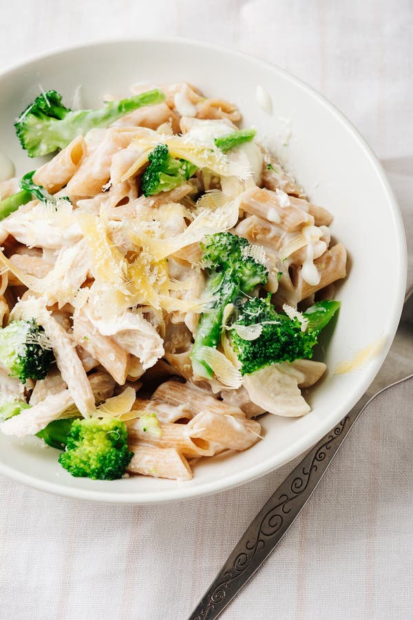 Whole Grain Penne Pasta with Chicken and Green Vegetables Stock Photo