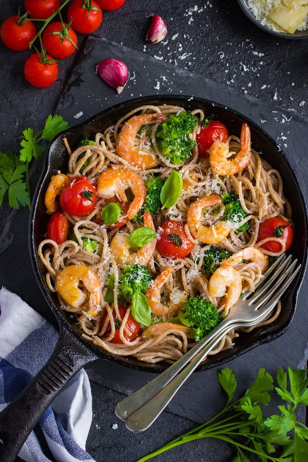 Whole Grain Spaghetti Pasta with Shrimps and Broccoli Stock Photo