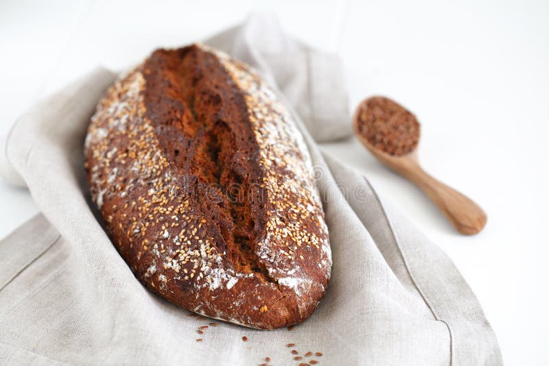 Whole grain wheat bread loaf with sesame and buckwheat