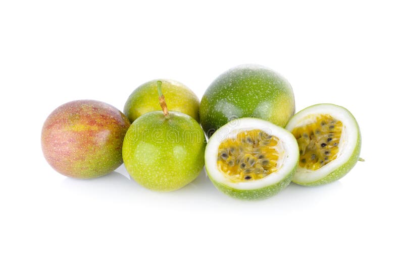 Whole and half cut passion fruit on white background