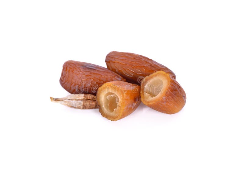 Whole and half date fruit with seed on white background