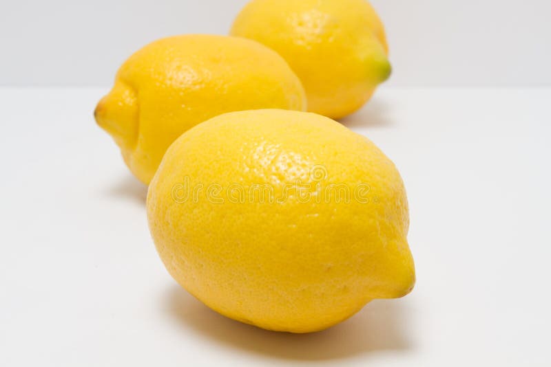 Whole lemons on a white background stock photo
