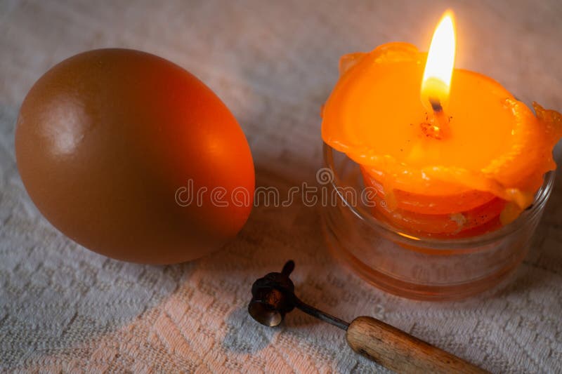 Whole Raw Egg, Candle and Easter Eggs Wax Painting Tool Stock Image