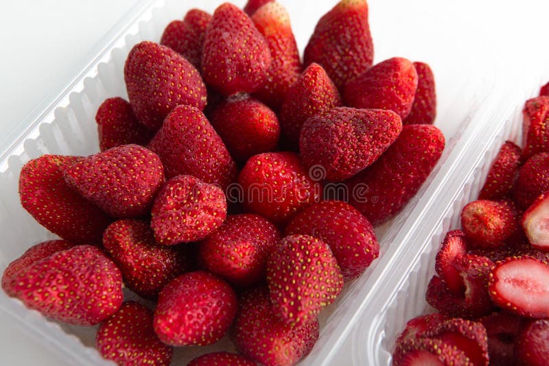 Whole Red Berries. Plastic Containers with Fresh Frozen Strawberries ...