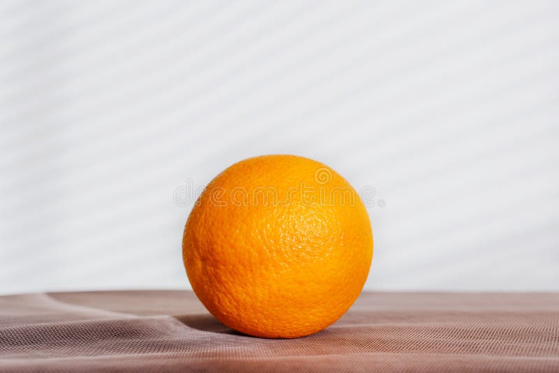 A whole round bright orange lies royalty free stock photography A whole round bright orange lies royalty free stock photography