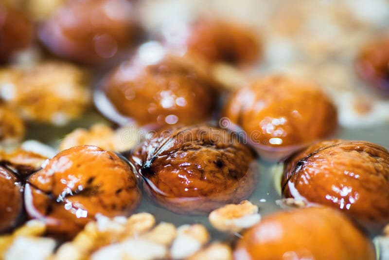 Whole walnut in water. stock photo. Image of ingredient 101408232