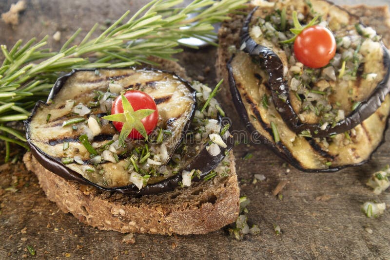 Bruschetta with Grilled Aubergine and Pachino Tomatoes Stock Image ...