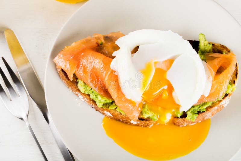 Wholemeal Bread Toast, Smashed Avocado, Salmon and Poached Egg Stock