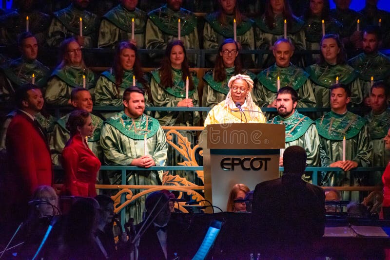 Orlando, Florida.  December 06, 2019. Whoopi Goldberg telling the touching story of Christmas, accompanied by orchestra and heavenly choir in Candlelight Narrators at Epcot 1 9. Orlando, Florida.  December 06, 2019. Whoopi Goldberg telling the touching story of Christmas, accompanied by orchestra and heavenly choir in Candlelight Narrators at Epcot 1 9