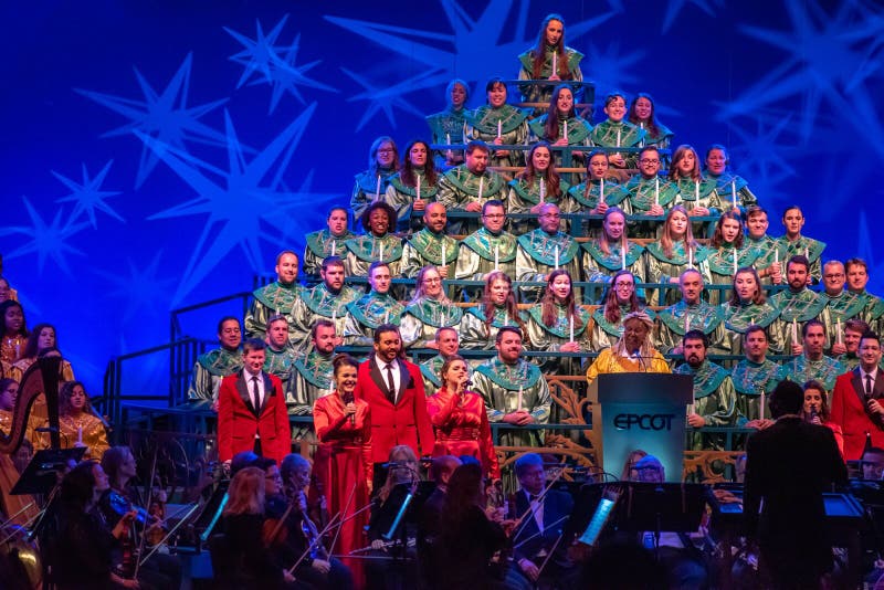 Orlando, Florida.  December 06, 2019. Whoopi Goldberg telling the touching story of Christmas, accompanied by orchestra and heavenly choir in Candlelight Narrators at Epcot 1. Orlando, Florida.  December 06, 2019. Whoopi Goldberg telling the touching story of Christmas, accompanied by orchestra and heavenly choir in Candlelight Narrators at Epcot 1