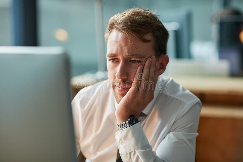 Why Does this Day Feel so Long. a Bored Businessman Staring Blankly at