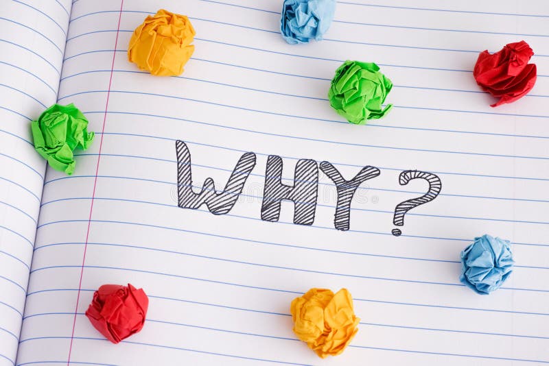 Why question on notebook sheet with some colorful crumpled paper balls on it royalty free stock photos
