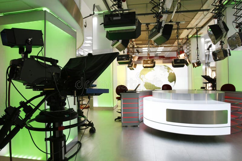 Camera prompter and professional lightning in a new television studio with news desk. Camera prompter and professional lightning in a new television studio with news desk
