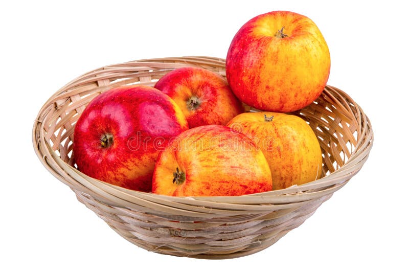 Wicker basket with apples on a white background