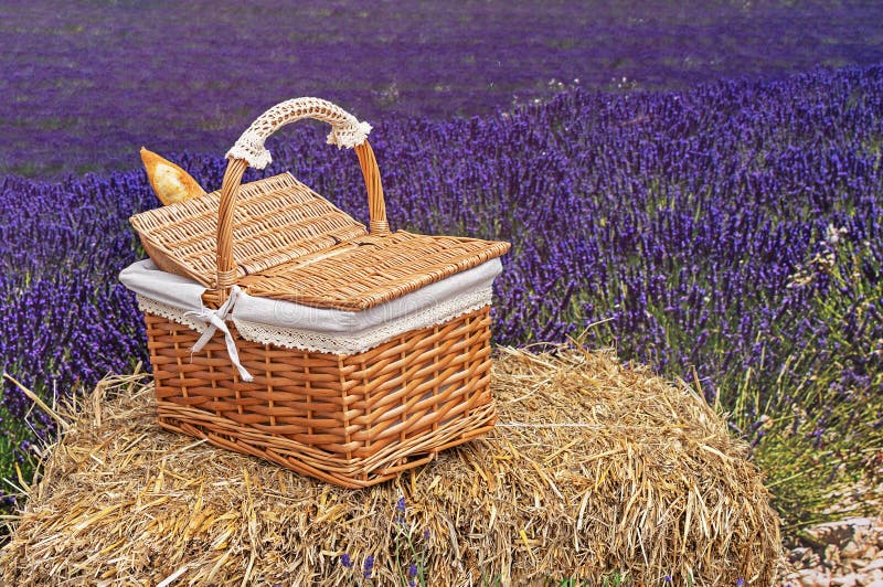 Wicker basket with baguette on the hay. Rustic design for design and decoration