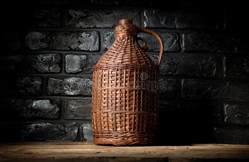 Wicker bottle in cellar