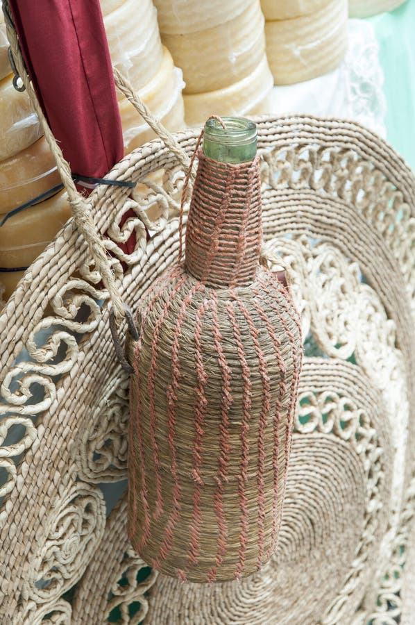 Wicker bottle with cheese stock image. Image of tinto 40968579