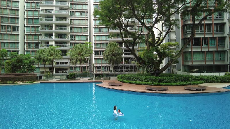 wide angle view of a beautiful swimming pool in the condominium, Singapore holiday, aerial