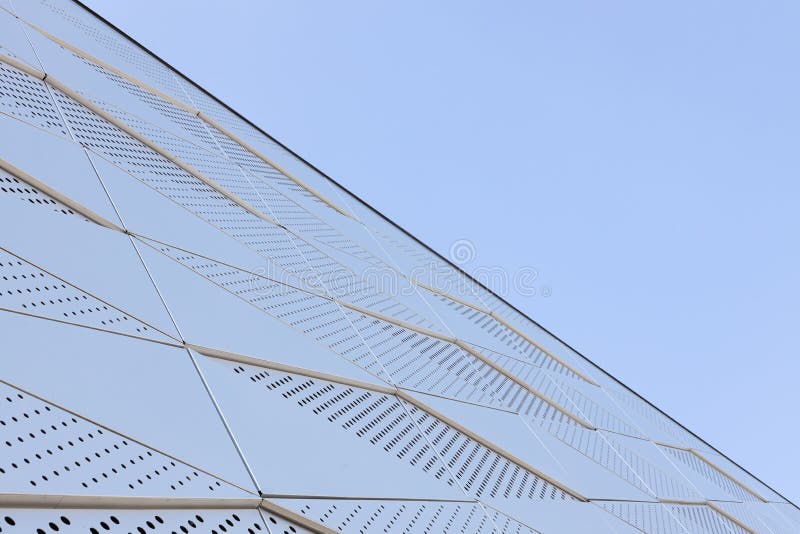 Wide Angle View of Metal Wall with Triangular Pattern and Round ...