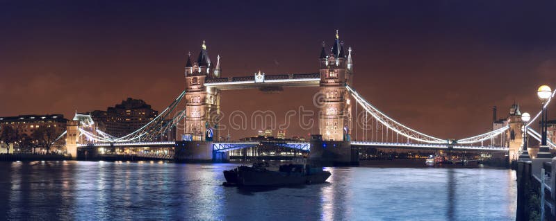 Wide night panorama of London Tower bridge