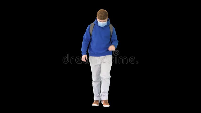 Schoolboy with backpack wearing medical mask walking, Alpha Channel