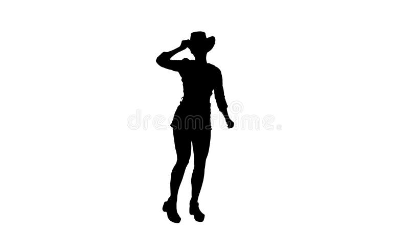 Silhouette young lady in a cowboy hat dancing.