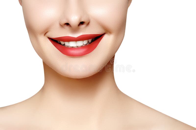 Wide smile of young beautiful woman with perfect healthy white teeth on grey background. Dental whitening, ortodont, care tooth and wellness. Red lipstick makeup on female lips. Wide smile of young beautiful woman with perfect healthy white teeth on grey background. Dental whitening, ortodont, care tooth and wellness. Red lipstick makeup on female lips.