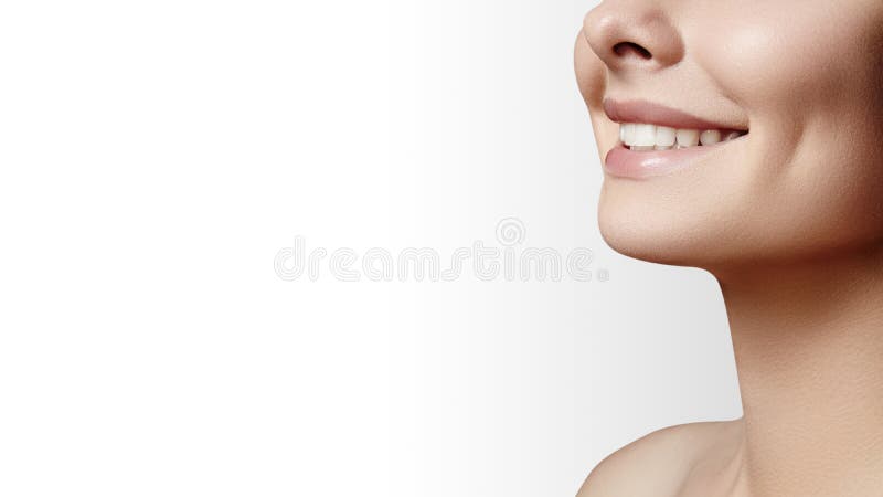 Wide smile of young beautiful woman with perfect healthy white teeth on grey background. Dental whitening, ortodont, care tooth and wellness. Natural makeup on perfect face. Wide smile of young beautiful woman with perfect healthy white teeth on grey background. Dental whitening, ortodont, care tooth and wellness. Natural makeup on perfect face.