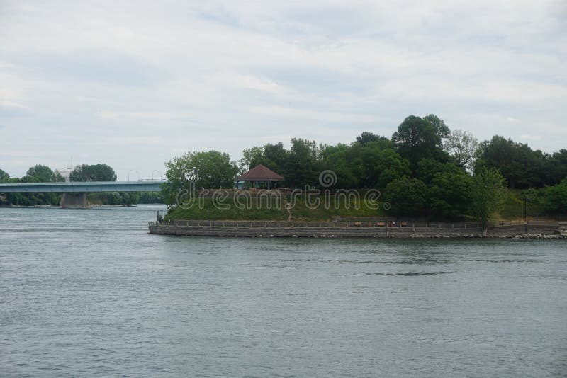 A beautiful skyline view of Dieppe park Montreal with a pergolas in the middle. Foreground is Saint Laurent River. A beautiful skyline view of Dieppe park Montreal with a pergolas in the middle. Foreground is Saint Laurent River