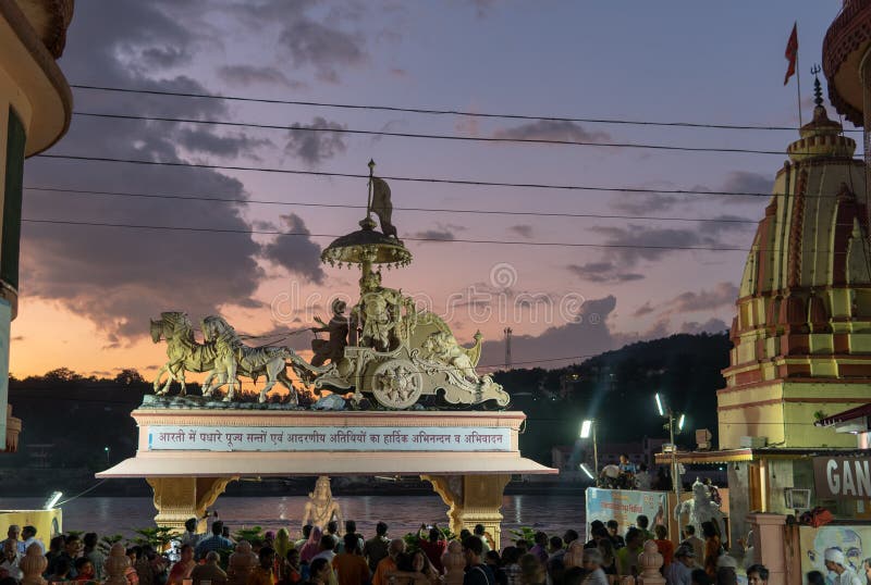 Walking the streets of Rishikesh during Yoga Training in India, statue, sunset, ancient, arjun, arjuna, art, asia, asian, chariot, culture, ganga, aarti, god, hindu, hinduism, history, horse, indian, krishna, painting, kurukshetra, lord, mahabharat, mahabharata, monument, niketan, parmarth, religion, religious, sculpture, spirituality, traditional, transportation, travel, twilight, visit, wheel, worship. Walking the streets of Rishikesh during Yoga Training in India, statue, sunset, ancient, arjun, arjuna, art, asia, asian, chariot, culture, ganga, aarti, god, hindu, hinduism, history, horse, indian, krishna, painting, kurukshetra, lord, mahabharat, mahabharata, monument, niketan, parmarth, religion, religious, sculpture, spirituality, traditional, transportation, travel, twilight, visit, wheel, worship