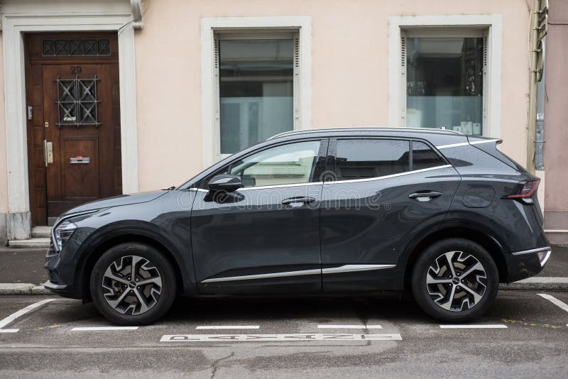 Mulhouse - France - 2 April 2024 - profile view of grey Kia sportage SUV car parked in the street. Mulhouse - France - 2 April 2024 - profile view of grey Kia sportage SUV car parked in the street