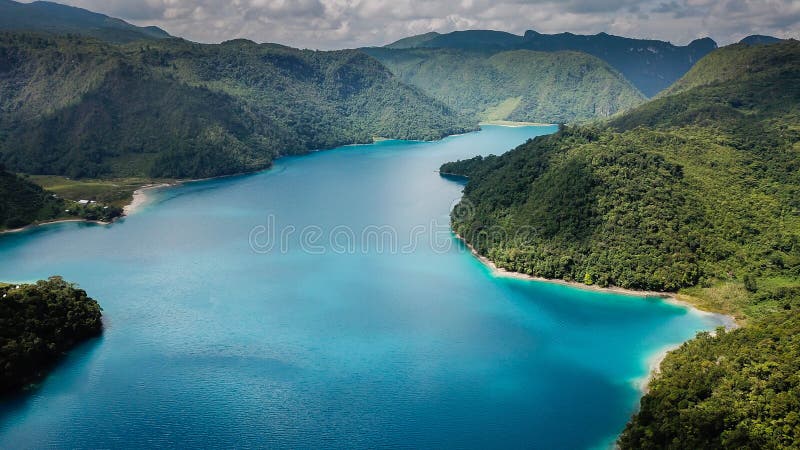 Laguna BravaÂ SpanishÂ for wild or rough lake, also known asÂ YolnabajÂ is aÂ karstic lakeÂ inÂ Guatemala. It is situated in the municipality ofÂ NentÃ³nÂ Huehuetenango, close to the border withÂ Mexico. The lake is fed by several streams and subterraneous watercourses.
The area around Laguna Brava has been inhabited byÂ MayanÂ communities of theÂ ChujÂ ethnicity since the 19th century. In the year 2000 a conflict over land usage emerged between indigenous communities depending on the land, and the American owners that just acquired it in order to transform it into a nature reserve. Laguna BravaÂ SpanishÂ for wild or rough lake, also known asÂ YolnabajÂ is aÂ karstic lakeÂ inÂ Guatemala. It is situated in the municipality ofÂ NentÃ³nÂ Huehuetenango, close to the border withÂ Mexico. The lake is fed by several streams and subterraneous watercourses.
The area around Laguna Brava has been inhabited byÂ MayanÂ communities of theÂ ChujÂ ethnicity since the 19th century. In the year 2000 a conflict over land usage emerged between indigenous communities depending on the land, and the American owners that just acquired it in order to transform it into a nature reserve.