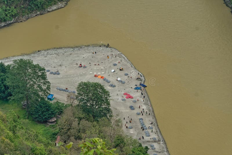 Darjeeling, West bengal, India, 05.27.2023. aerial view of a trekking camp near river bed. Darjeeling, West bengal, India, 05.27.2023. aerial view of a trekking camp near river bed