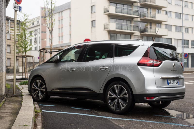 Mulhouse - France - 2 April 2024 - rear view of grey renault scenic fourth generation parked in the street. Mulhouse - France - 2 April 2024 - rear view of grey renault scenic fourth generation parked in the street