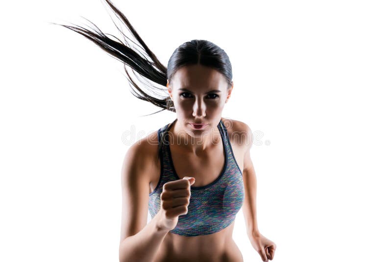 I see a purpose, but I don`t see obstacles! Portrait of strong powerful attractive sporty focused confident woman with perfect body, she is running fast, isolated on white background. I see a purpose, but I don`t see obstacles! Portrait of strong powerful attractive sporty focused confident woman with perfect body, she is running fast, isolated on white background