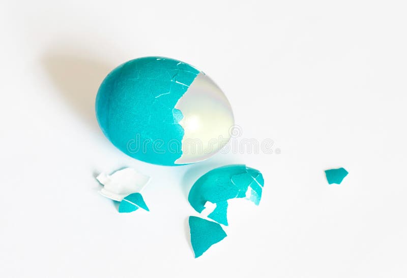 Easter egg and egg shells on white background, blue color. Easter egg and egg shells on white background, blue color