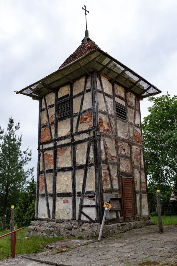 Wierzchowo, zachodniopomorskie / Poland - June 7, 2019: Old belfry from the Prussian wall and church in a small village in