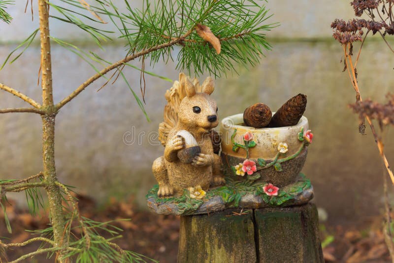 Squirrel and basket with cones, handmade sculpture squirrel, Kaliningrad region, Russia, February 02, 2020. Squirrel and basket with cones, handmade sculpture squirrel, Kaliningrad region, Russia, February 02, 2020