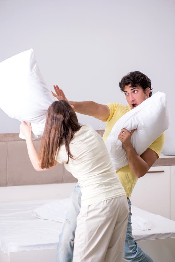 The Wife and Husband Having Pillow Fight in Bedroom Stock Image - Image of  happy, divorcing: 137551785