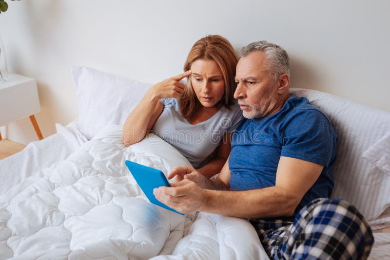Wife and husband after reading political news on tablet royalty free stock photos Wife and husband after reading political news on tablet royalty free stock photos