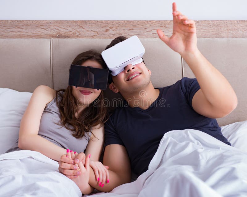 Wife And Husband With Virtual Reality Goggles In The Bed Stock Image ...